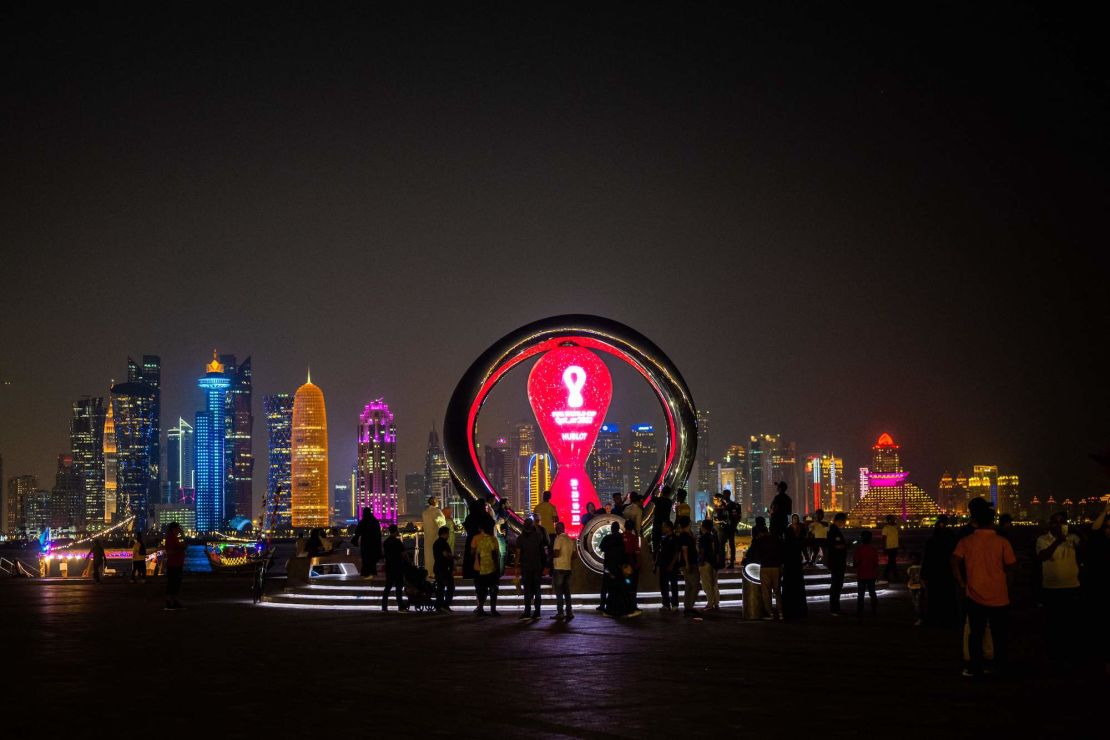 Visitors gather at the FIFA World Cup countdown clock in Doha on October 30, 2022.