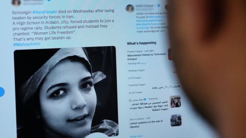 A person looks on October 20 at a tweet about the reported death of 15-year-old Iranian girl Asra Panahi.