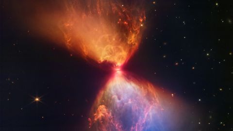 A newborn star is at the heart of a new James Webb Space Telescope image that looks like an hourglass.