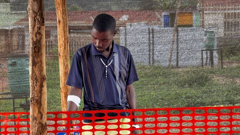A 30-year-old driver, Robert Twinamasiko receives treatment for Ebola after helping an infected friend to an ambulance.