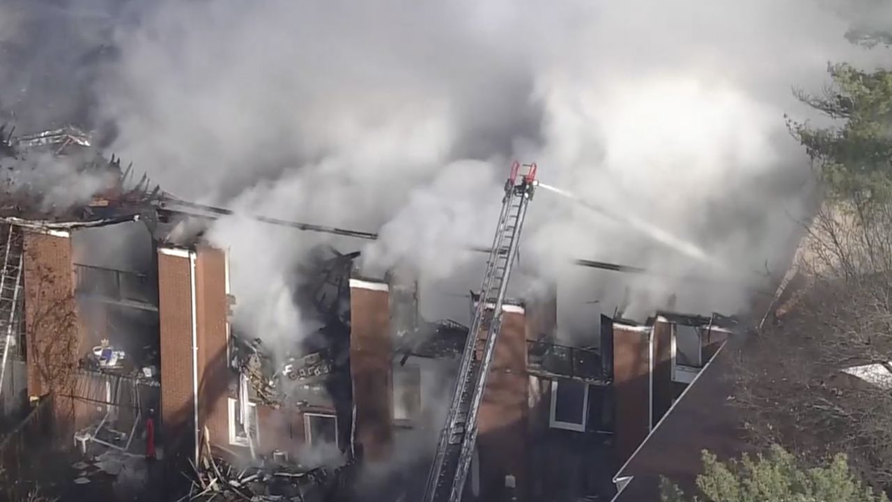 Crews battle a blaze at a partially collapsed building in Montgomery County, Maryland, on Wednesday. 