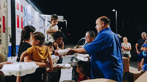 Mercy Chefs founder, Gary LeBlanc, hands out meals in the aftermath of Hurricane Ian. 
