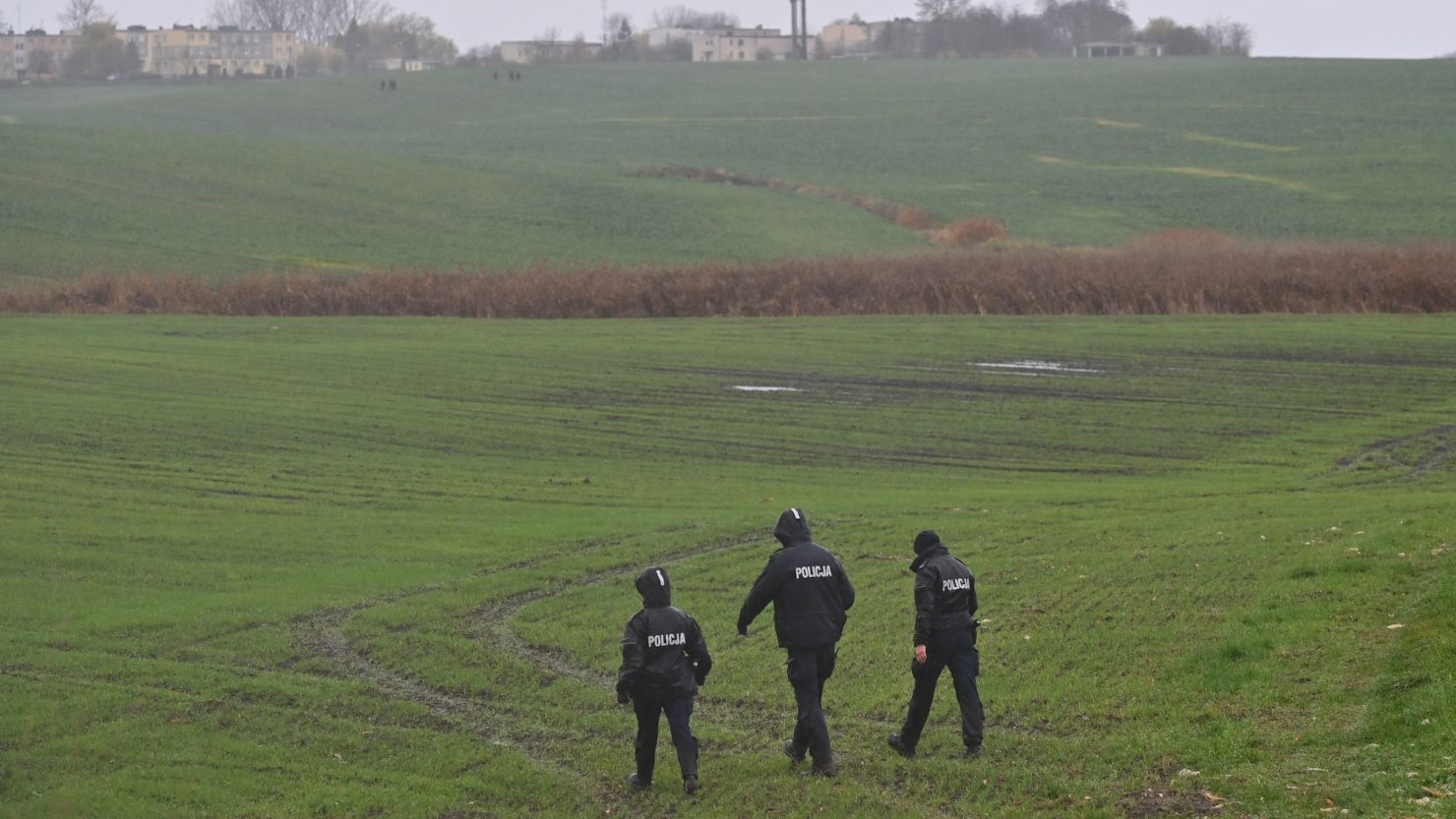 Members of the police searching the fields near the village of Przewodow, a day after two people were killed in an explosion at a farm by the Polish village. 