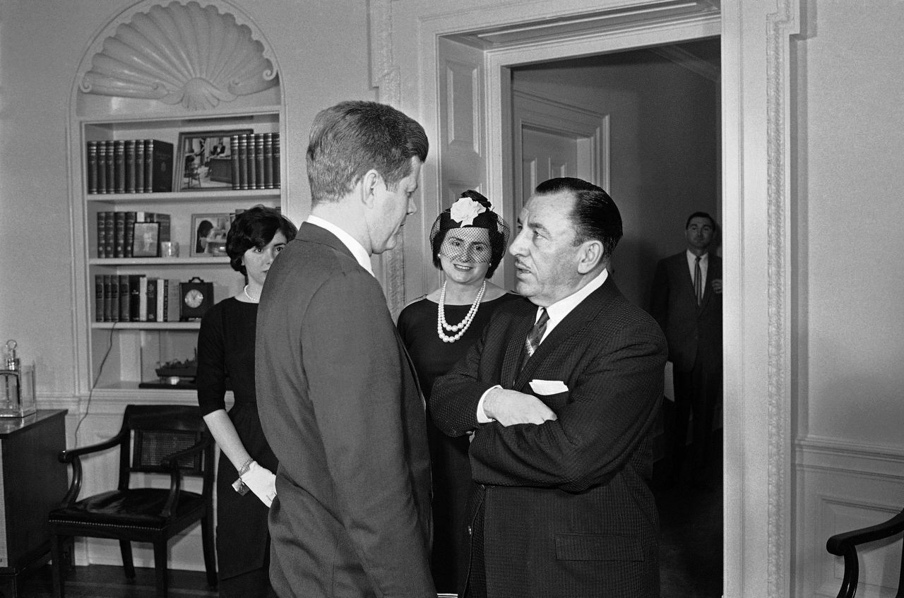 Pelosi, left, and her mother watch as her father, Thomas D'Alesandro, speaks with President John F. Kennedy at the White House in 1961 after taking the oath to become a member of the Federal Renegotiation Board. Her father was previously the mayor of Baltimore and a US congressman.