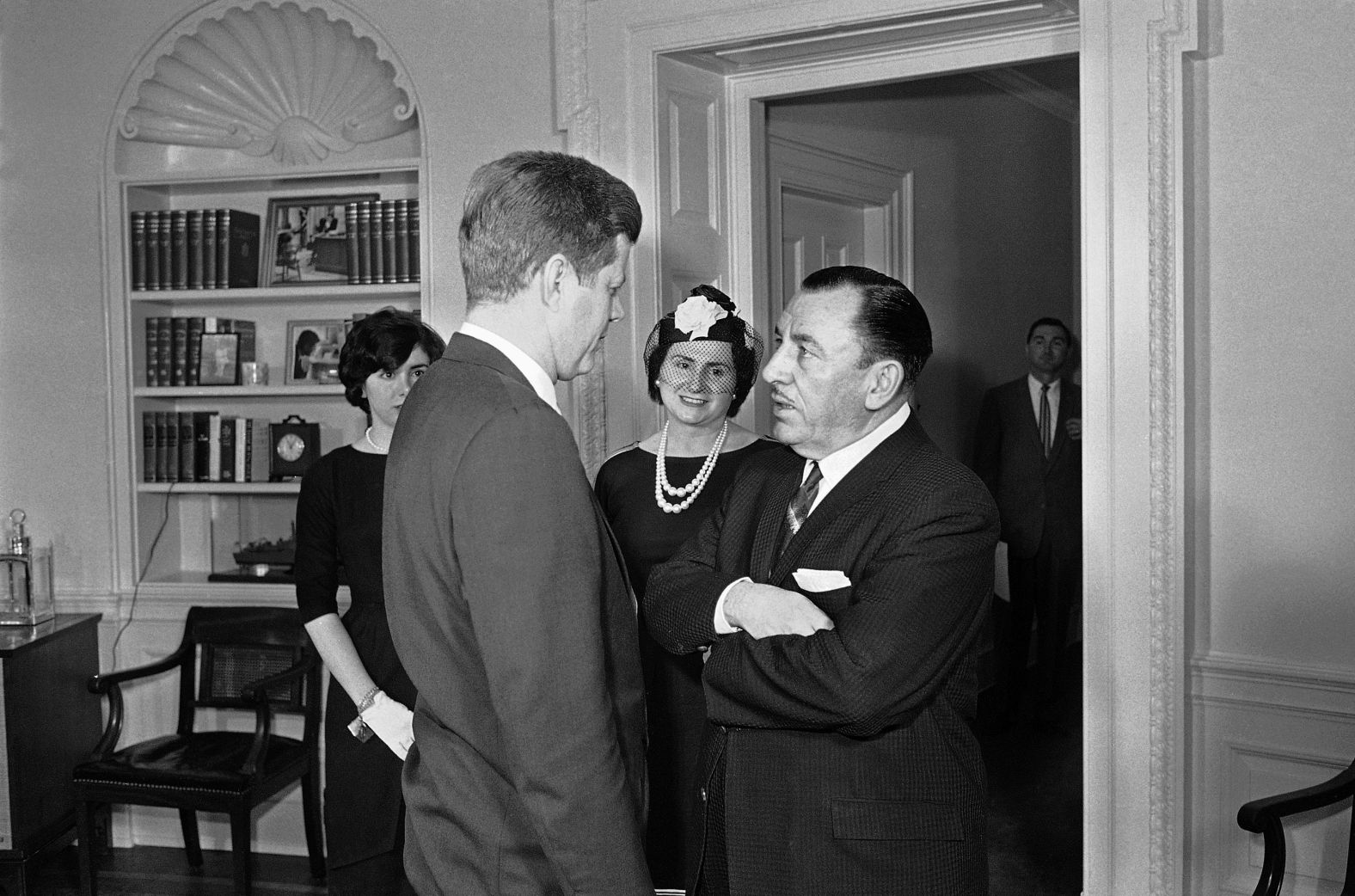 Pelosi, left, and her mother watch as her father, Thomas D'Alesandro, speaks with President John F. Kennedy at the White House in 1961 after taking the oath to become a member of the Federal Renegotiation Board. Her father was previously the mayor of Baltimore and a US congressman.