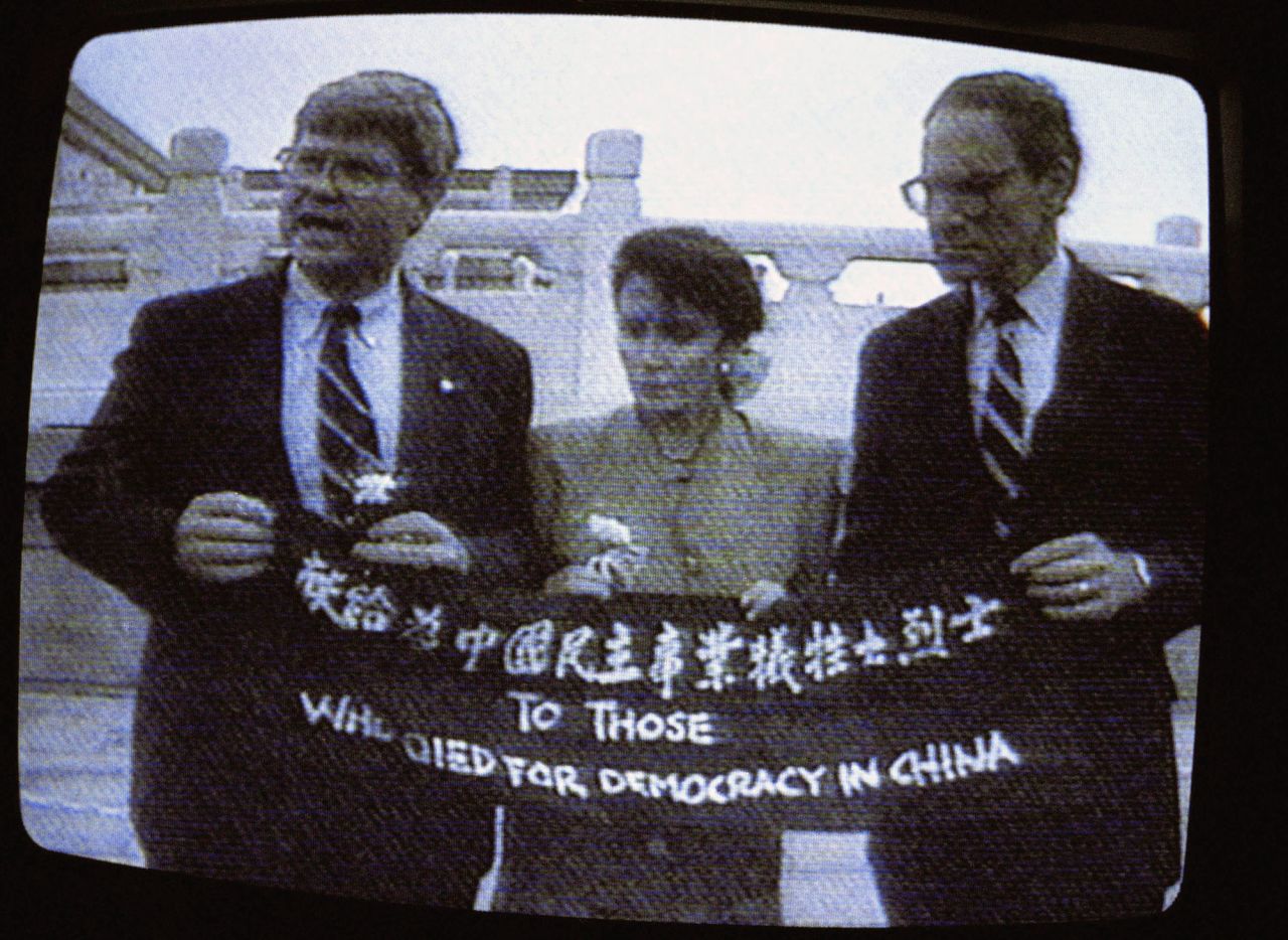 Pelosi and fellow US Reps. Ben Jones, left, and John Miller unfold a banner during a trip to Beijing in 1991. The banner says, "To those who died for democracy in China," honoring the victims of the crackdown on Tiananmen Square protesters in 1989. Throughout her career in Congress, Pelosi has a long history of <a href="https://www.cnn.com/2022/08/02/politics/gallery/pelosi-china-history/index.html" target="_blank">representing the US to Chinese officials</a>, including standing up to Beijing as well as presidents from her own party.