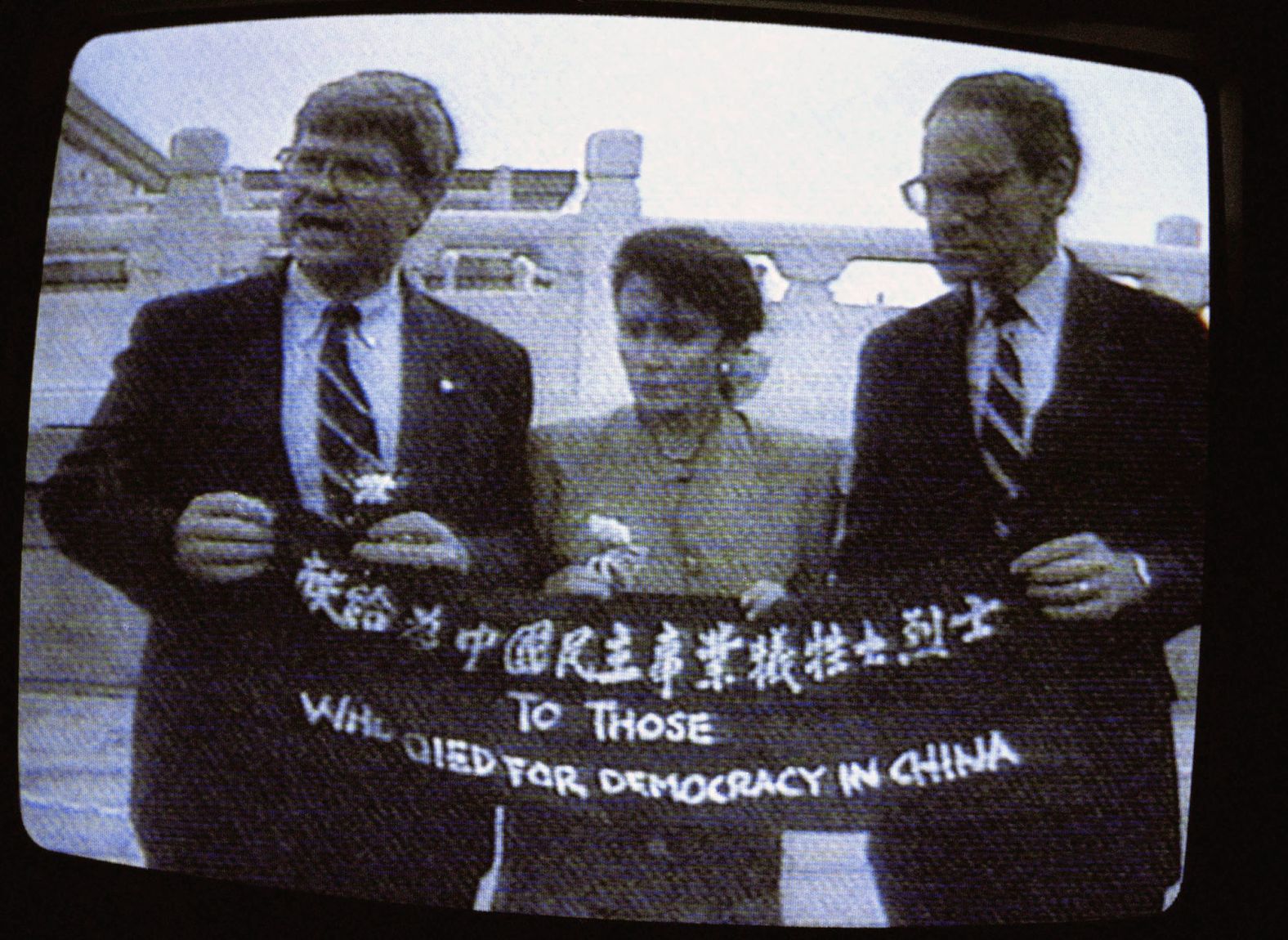 Pelosi and fellow US Reps. Ben Jones, left, and John Miller unfold a banner during a trip to Beijing in 1991. The banner says, "To those who died for democracy in China," honoring the victims of the crackdown on Tiananmen Square protesters in 1989. Throughout her career in Congress, Pelosi has a long history of <a href="index.php?page=&url=https%3A%2F%2Fwww.cnn.com%2F2022%2F08%2F02%2Fpolitics%2Fgallery%2Fpelosi-china-history%2Findex.html" target="_blank">representing the US to Chinese officials</a>, including standing up to Beijing as well as presidents from her own party.
