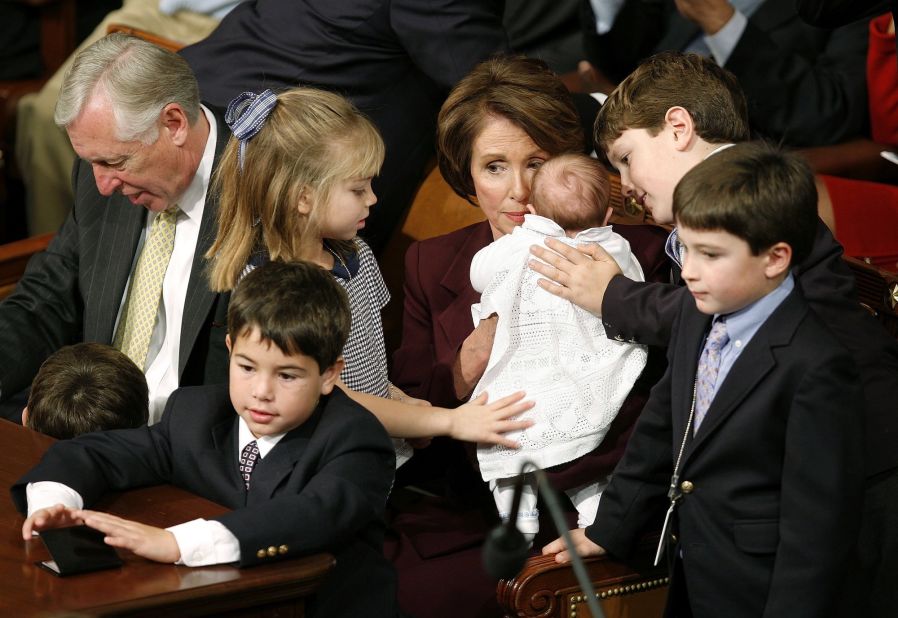 Pelosi sits with her grandchildren while being nominated as the next House Speaker during a swearing-in ceremony for the 110th Congress in 2007. She became the first female Speaker of the House.