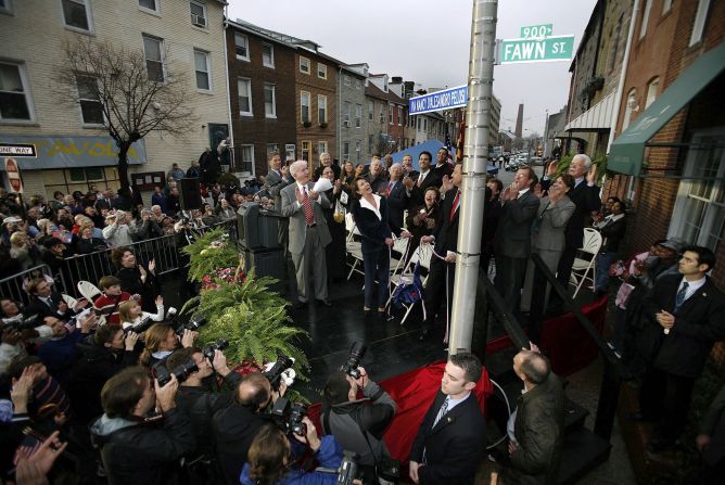 Pelosi looks at a new street sign bearing her name after its unveiling in 2007 in front of the corner row house where she grew up in Baltimore.