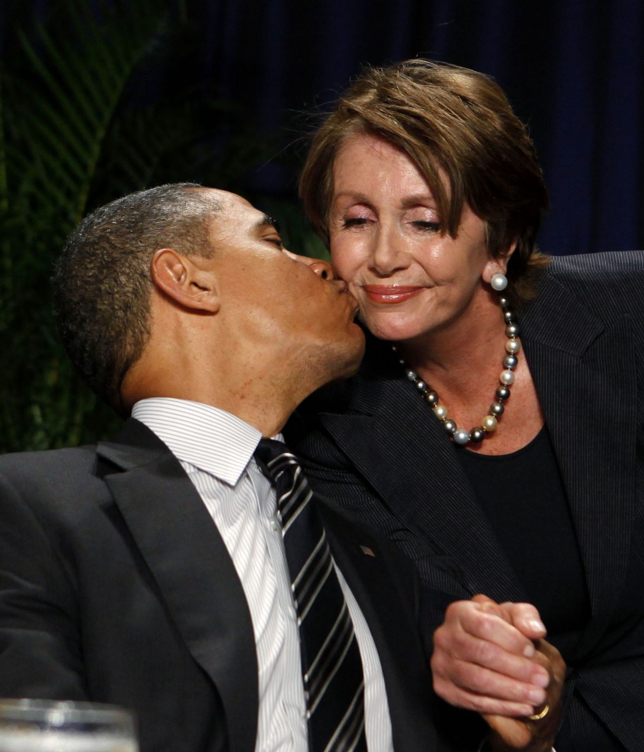 President Barack Obama greets Pelosi at the 2012 National Prayer Breakfast in Washington.