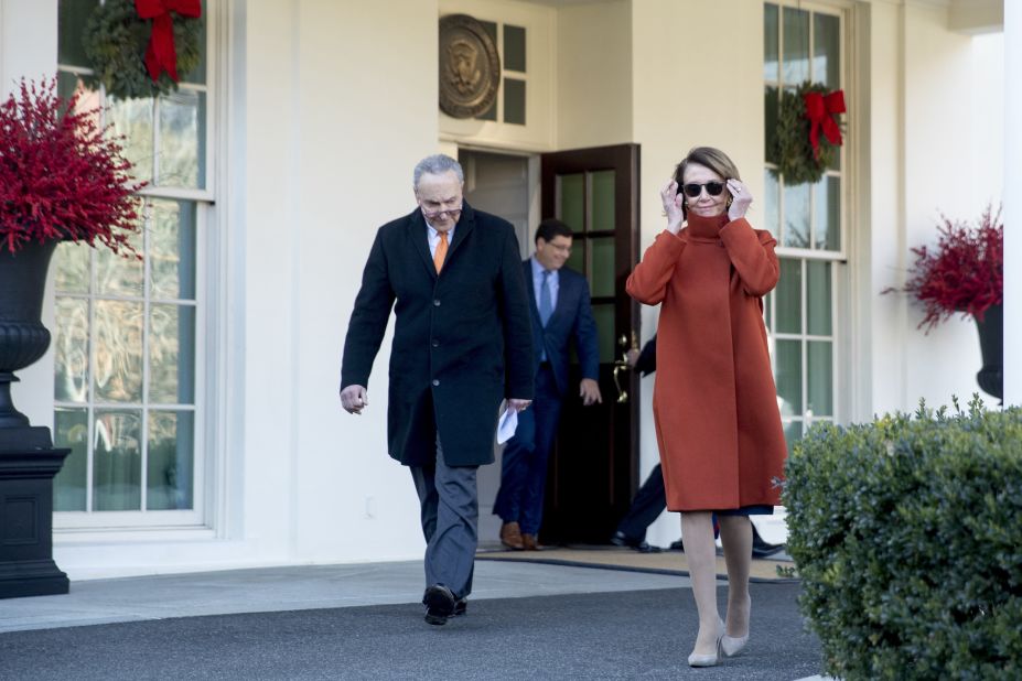Pelosi and Schumer walk out of the West Wing to speak to members of the media outside of the White House in 2018 following the meeting with President Trump. Pelosi's attire caught the attention of the internet, and the apparent popularity of her coat caused such a stir that the designer, Max Mara, <a href="https://www.cnn.com/2018/12/13/politics/nancy-pelosi-coat-max-mara/index.html" target="_blank">decided to bring it back</a>.