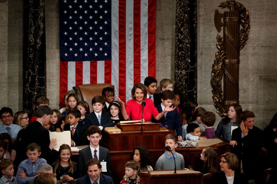 Pelosi is surrounded by children after being elected as the House Speaker in 2019.