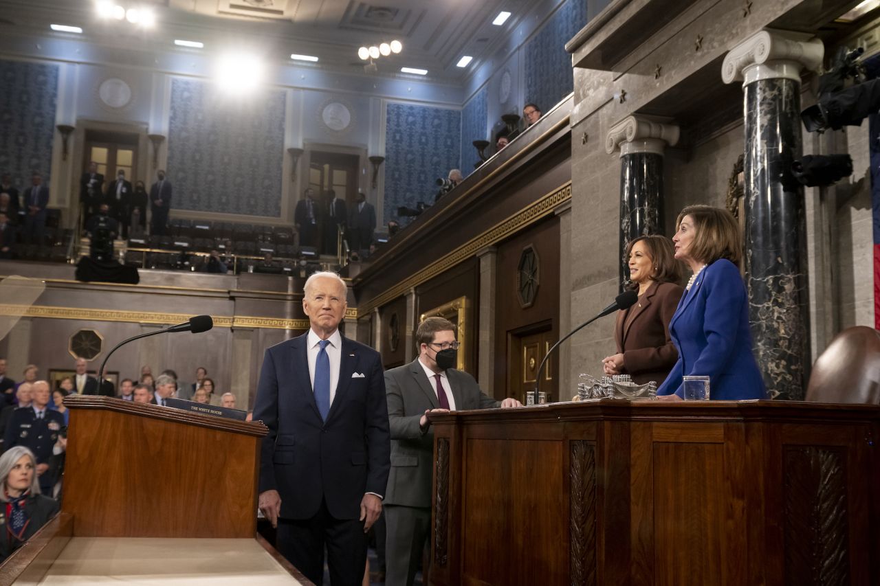 Harris and Pelosi look on as President Biden arrives to deliver the 2022 State of the Union address.