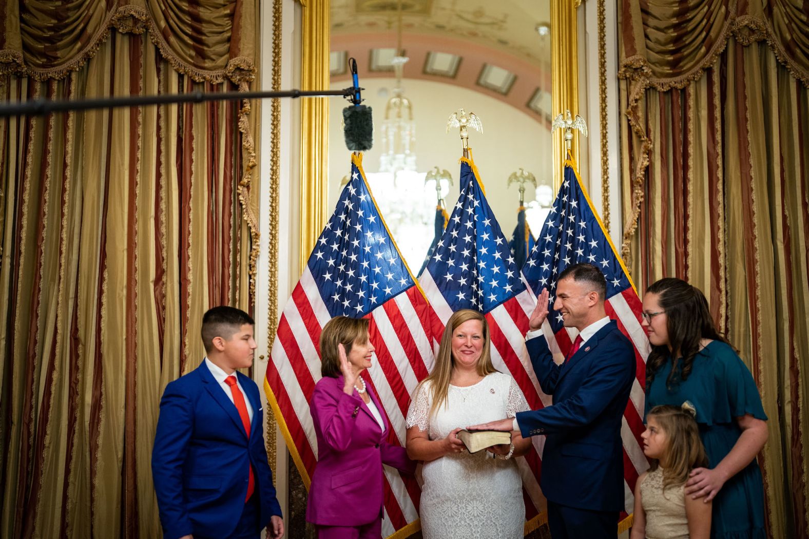 Pelosi participates in a ceremonial swearing-in photo opportunity for US Rep.-elect Rudy Yakym in November 2022.