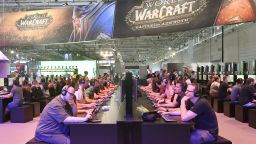 Visitors try out the latest 'World of Warcraft' video game at the Gamescom fair for computer games in Cologne, Germany, on Aug. 21, 2018.  (AP Photo/Martin Meissner, File)