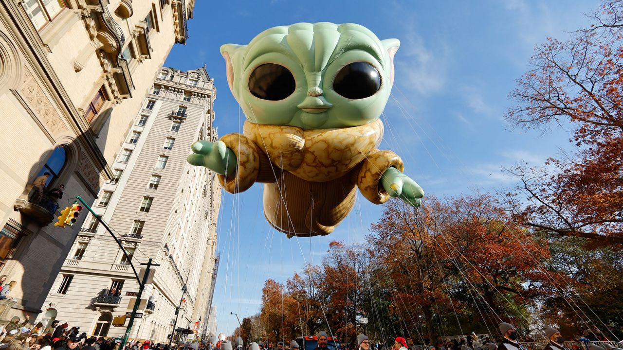 NEW YORK, NY - NOVEMBER 25: Baby Yoda, also known as the Grogu balloon floats along Central Park West in the Macy's Thanksgiving Day Parade on November 25, 2021 in New York City. (Photo by Gary Hershorn/Getty Images)