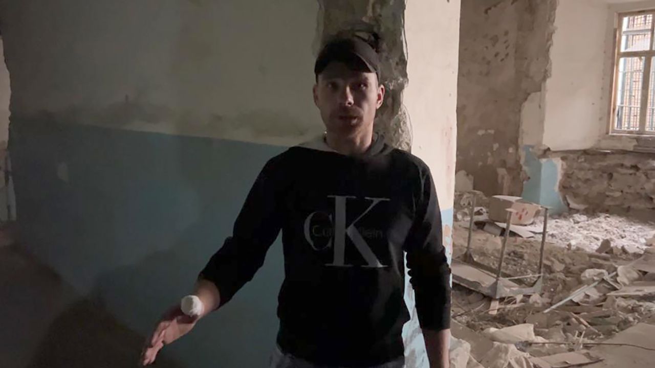 Oleksander, pictured at Kherson's central prison, says the Russian guards beat him daily when he was detained there under occupation.
