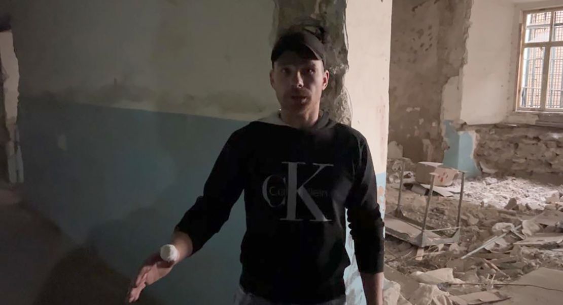 Oleksander, pictured at Kherson's central prison, says the Russian guards beat him daily when he was detained there under occupation.