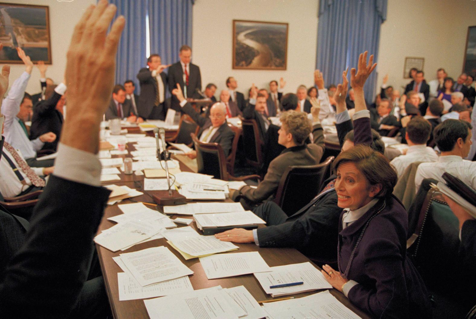 Pelosi, right, votes during a House Appropriations Committee meeting on budget cuts in 1995.