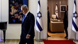 Benjamin Netanyahu walks during a ceremony where Israel President Isaac Herzog hands him the mandate to form a new government following the victory of the former premier's right-wing alliance in this month's election at the President's residency in Jerusalem November 13, 2022. REUTERS/ Ronen Zvulun