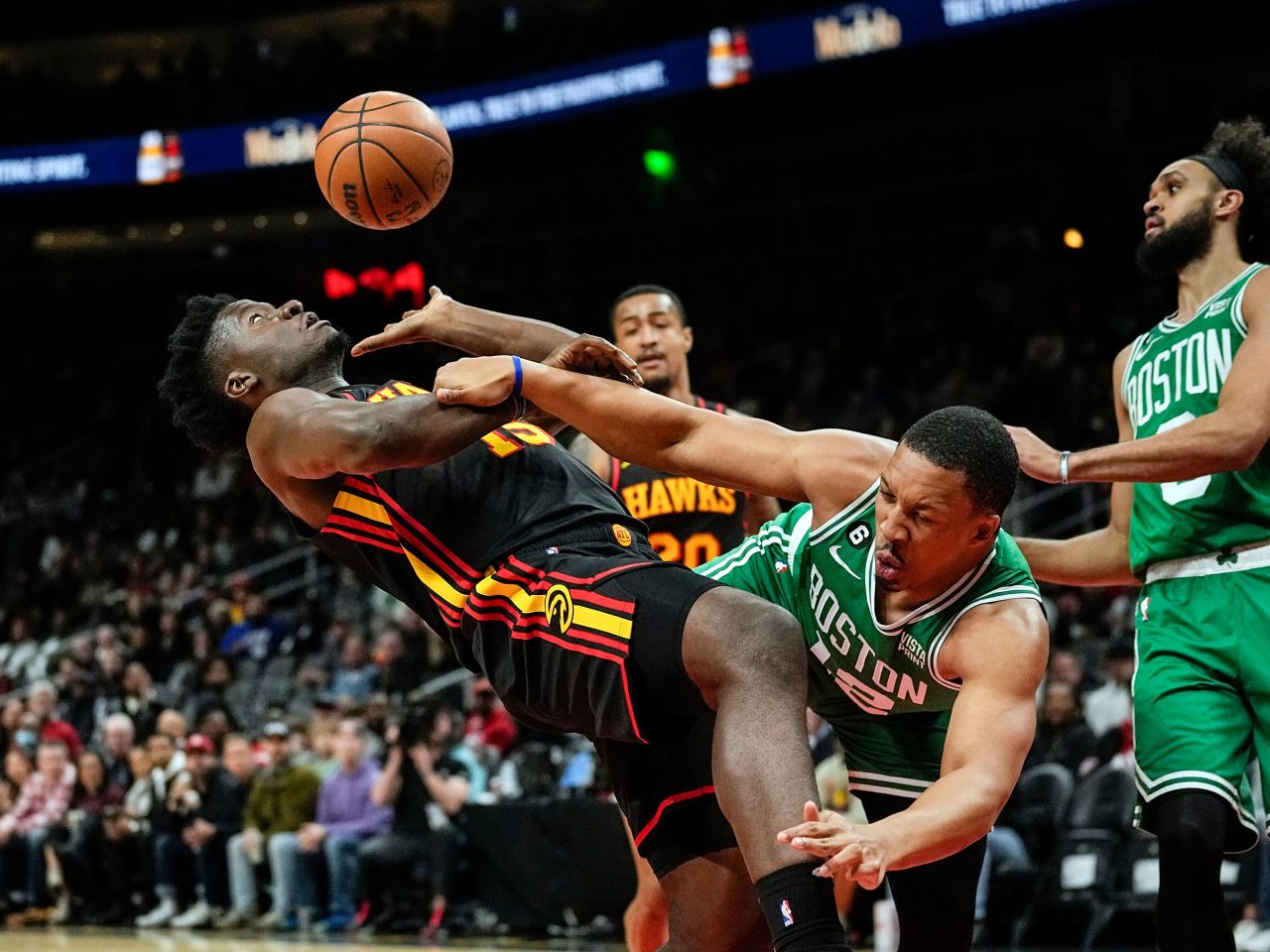 Atlanta center Clint Capela, left, is fouled by Boston's Grant Williams during an NBA game in Atlanta on Wednesday, November 16.