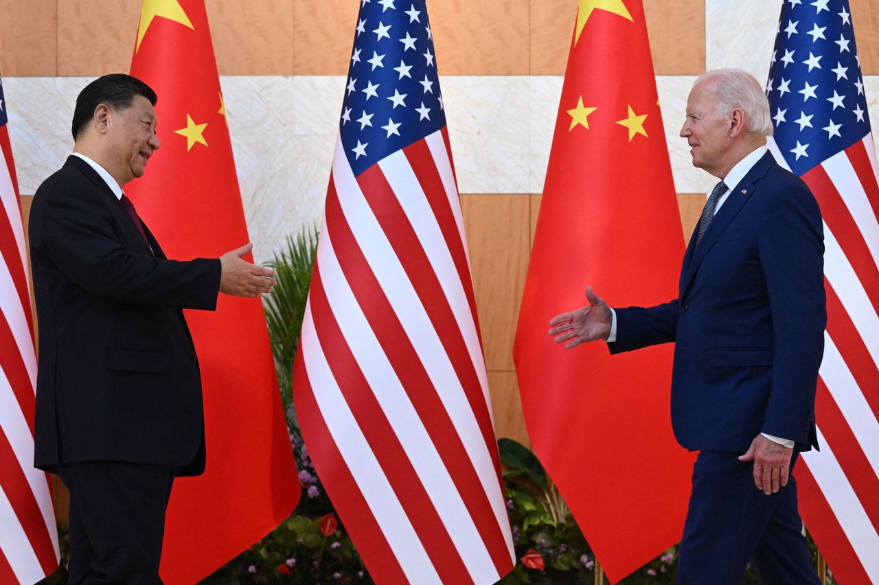 Chinese President Xi Jinping and US President Joe Biden reach out to shake hands before <a href="https://www.cnn.com/2022/11/14/politics/joe-biden-xi-jinping-china-us-relations" target="_blank">meeting on the sidelines of the G20 summit</a> in Bali, Indonesia, on Monday, November 14. The meeting yielded two important outcomes, according to the United States: a joint position that Russia must not use a nuclear weapon in Ukraine, and an expected resumption of climate talks between American and Chinese negotiators.