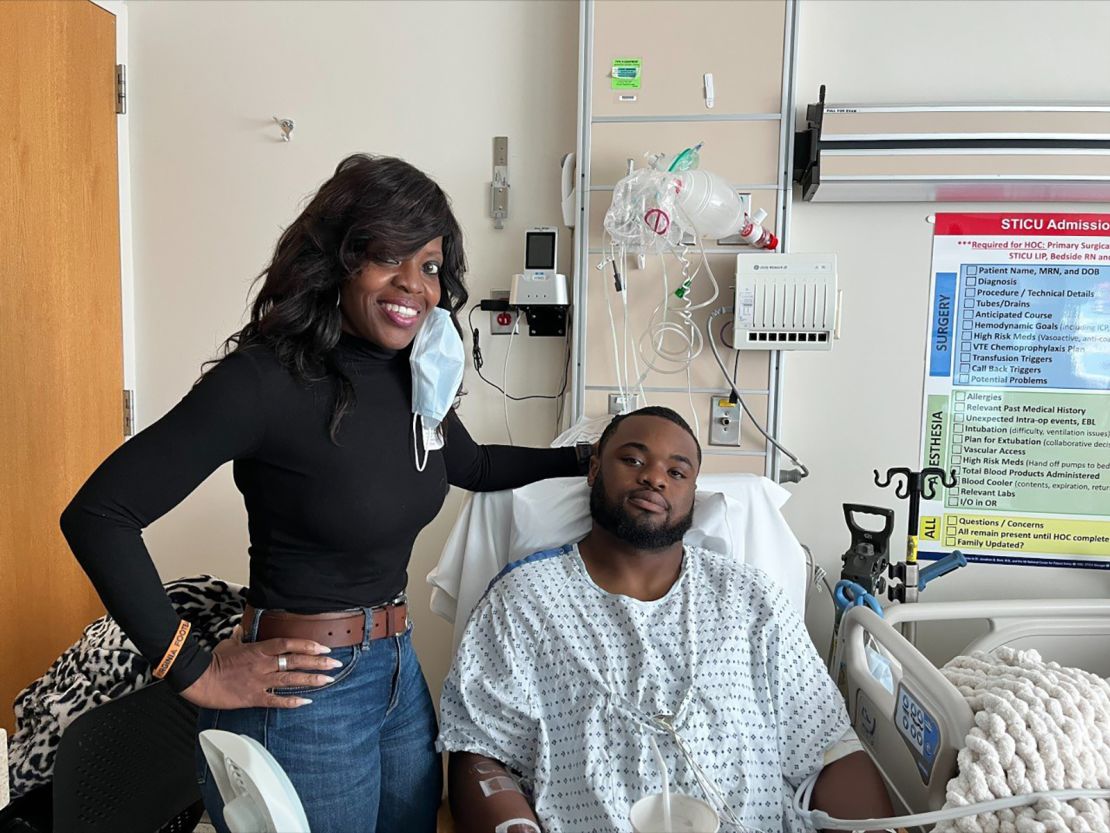 Mike Hollins in the hospital with his mother, Brenda.