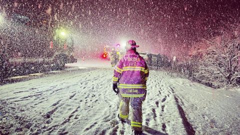 Firefighters respond to a vehicle crash on I-290 in Snyder, New York on Thursday.