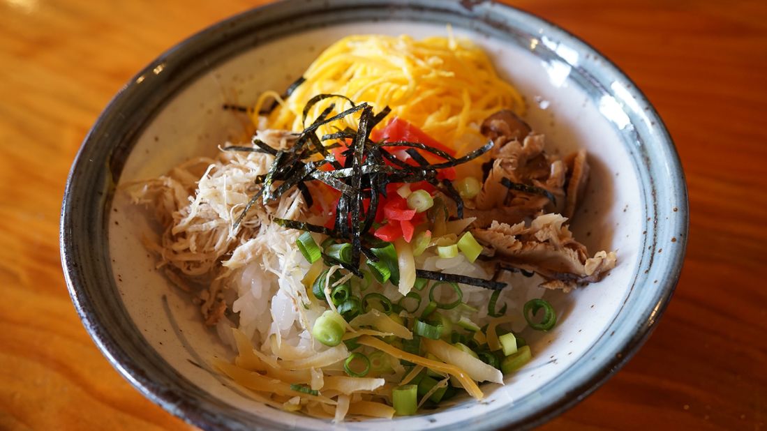 <strong>Keihan: </strong>The area's most celebrated and ubiquitous dish is keihan (chicken rice): soup-infused rice topped with shredded chicken, thin strips of egg and shiitake mushrooms. 