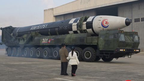 In this undated photo released by North Korea's Korean Central News Agency (KCNA) on Nov. 19, 2022, North Korean leader Kim Jong Un and his daughter inspect an intercontinental ballistic missile (ICBM). 