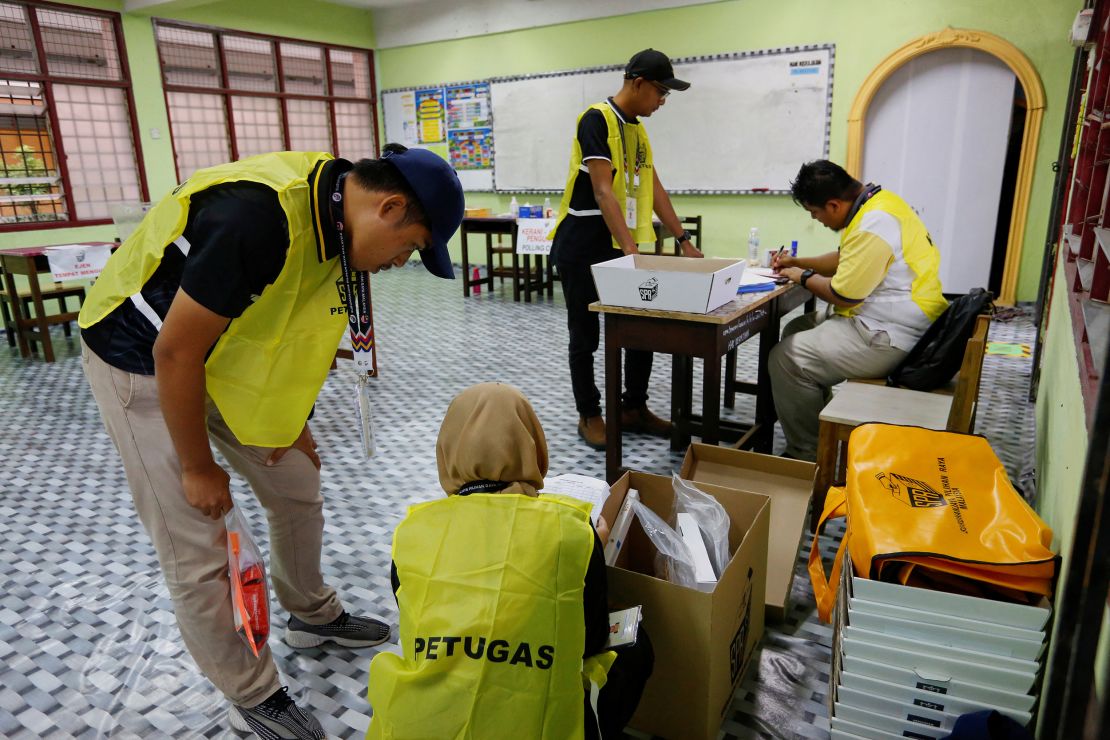 Election workers make a final preparation at a polling station during Malaysia's 15th general election, in Bera, Pahang, Malaysia November 19, 2022. 