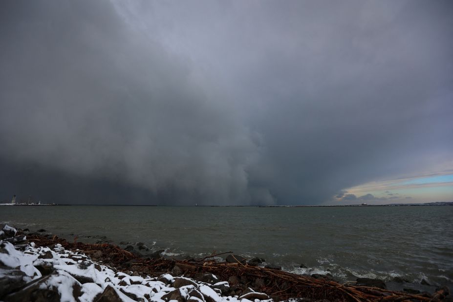 A cloud of snow is seen crossing Lake Erie as extreme winter weather hits Buffalo on Friday.