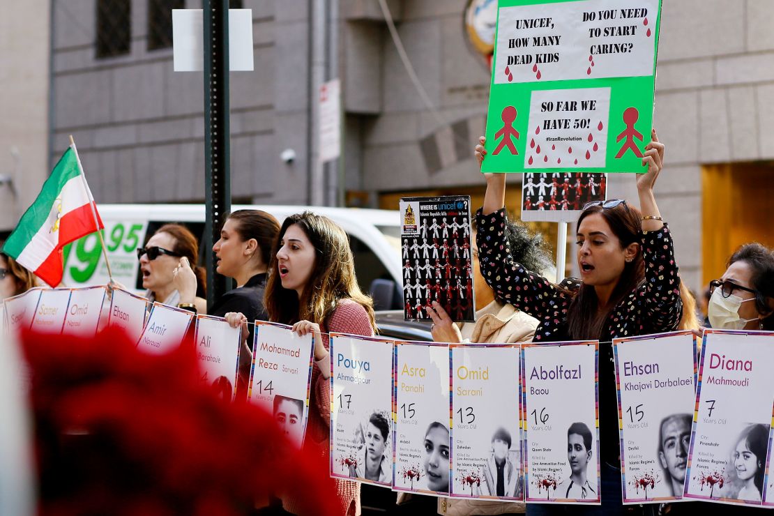 People shout slogans during a protest for the children of Iran at UNICEF headquarters in New York City on November 10, 2022.
