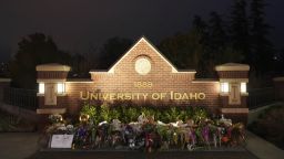 Flowers and other items are displayed at a growing memorial in front of a campus entrance sign for the University of Idaho, Wednesday, Nov. 16, 2022, in Moscow, Idaho. Four University of Idaho students were found dead on Sunday, Nov. 13, 2022, at a residence near campus. (AP Photo/Ted S. Warren)