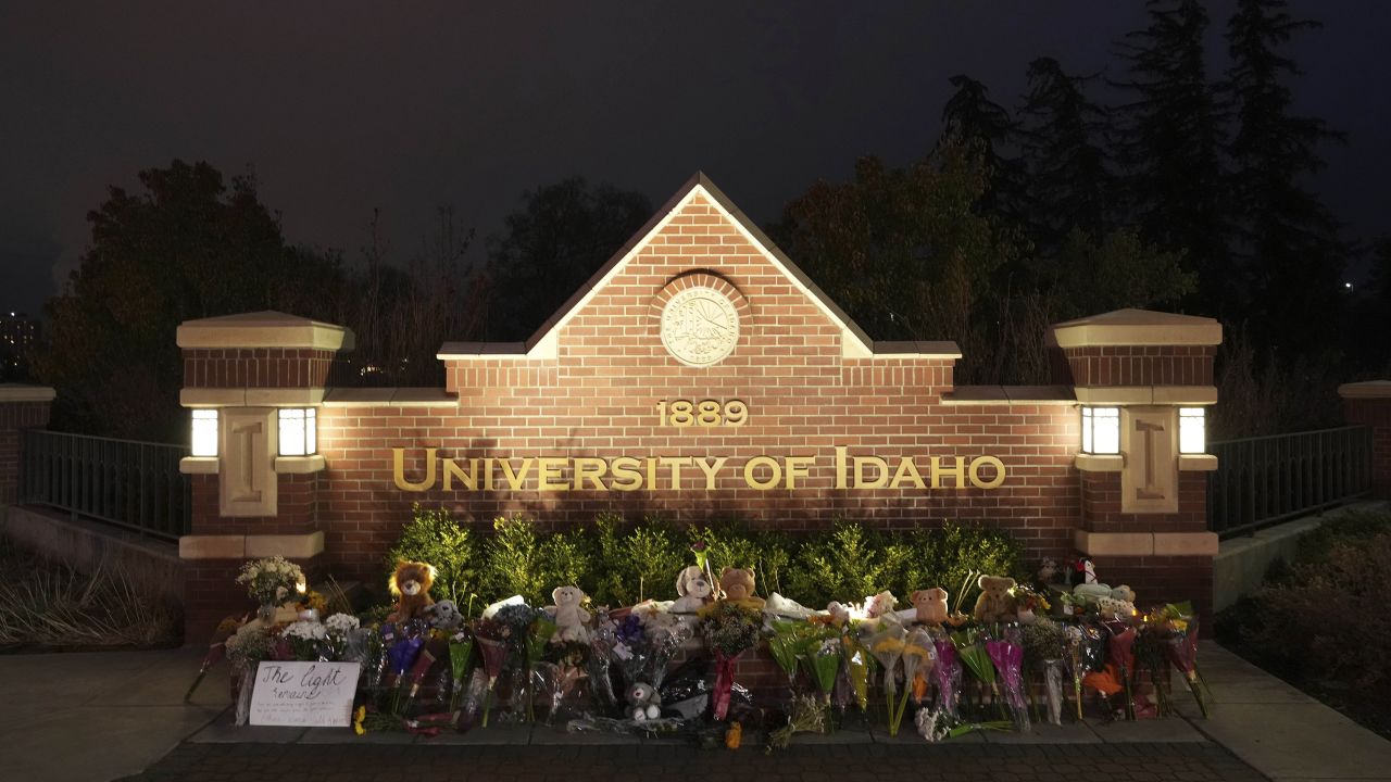Flowers and other items are displayed at a growing memorial in front of a campus entrance sign for the University of Idaho, Wednesday, Nov. 16, 2022, in Moscow, Idaho. 