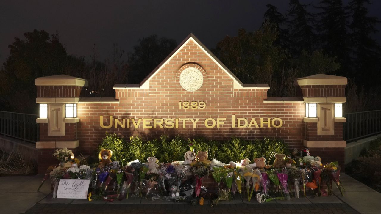 Flowers and other items are displayed at a growing memorial in front of a campus entrance sign for the University of Idaho, Wednesday, Nov. 16, 2022, in Moscow, Idaho. Four University of Idaho students were found dead on Sunday, Nov. 13, 2022, at a residence near campus. (AP Photo/Ted S. Warren)
