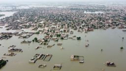 This aerial view shows a flooded residential area in Dera Allah Yar town after heavy monsoon rains in Jaffarabad district, Balochistan province on August 30, 2022. Aid efforts ramped up across flooded Pakistan on August 30 to help tens of millions of people affected by relentless monsoon rains that have submerged a third of the country and claimed more than 1,100 lives.