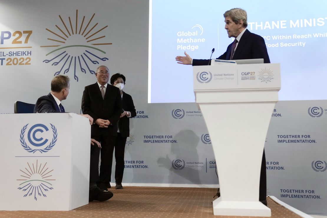 US Climate Envoy John Kerry gestures toward his Chinese counterpart Xie Zhenhua at the COP27 summit.