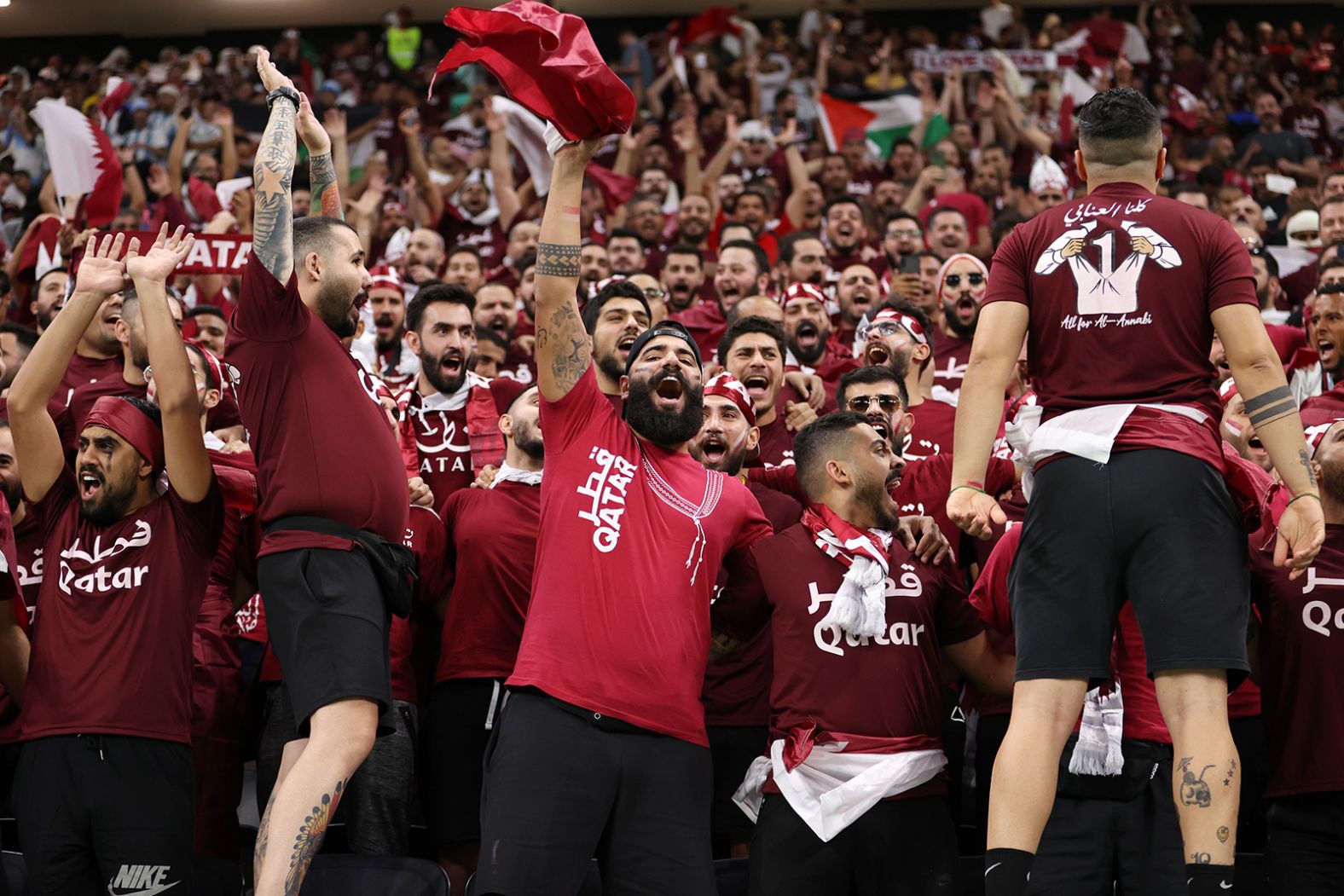 Qatari fans enjoy the pre-match atmosphere at Al Bayt Stadium on November 20.