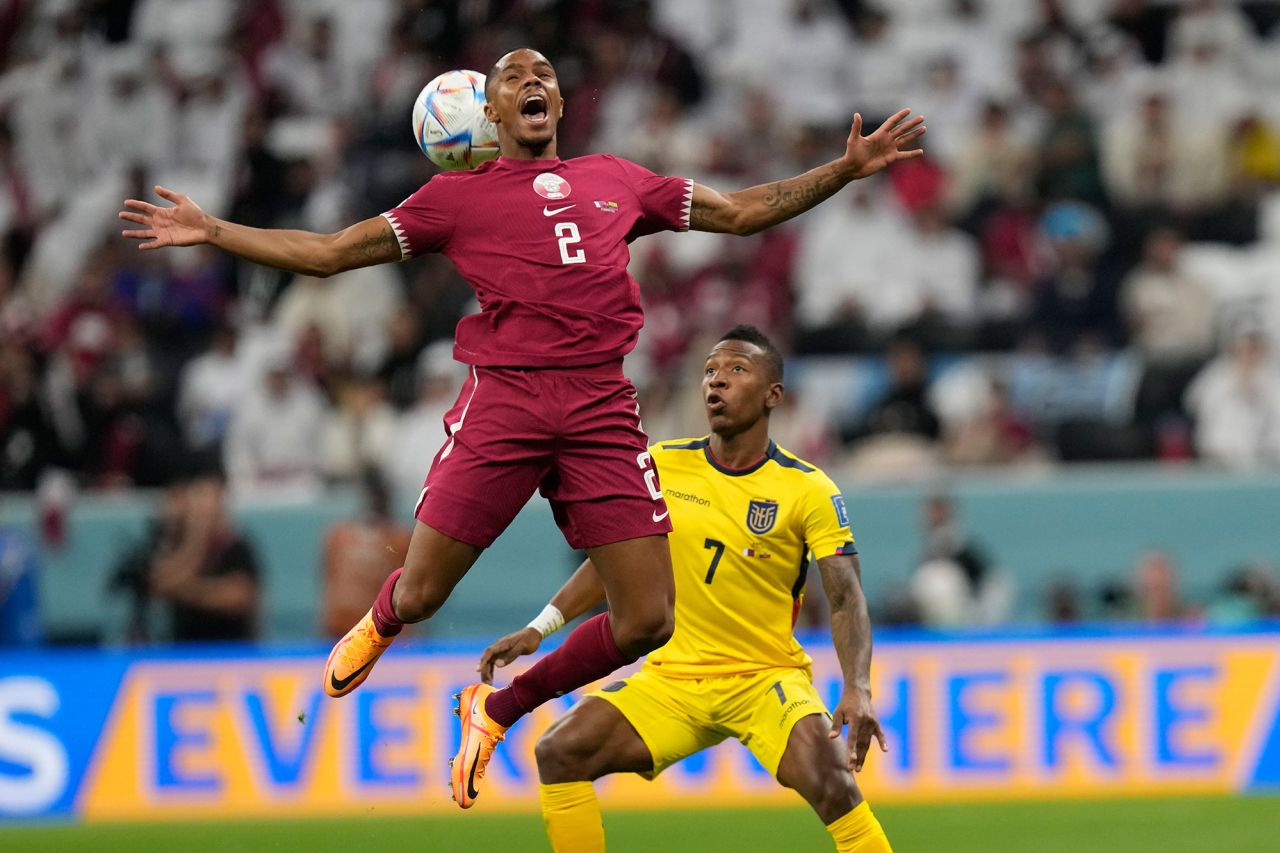 Qatar's Pedro Miguel challenges Ecuador's Pervis Estupiñán for the ball.