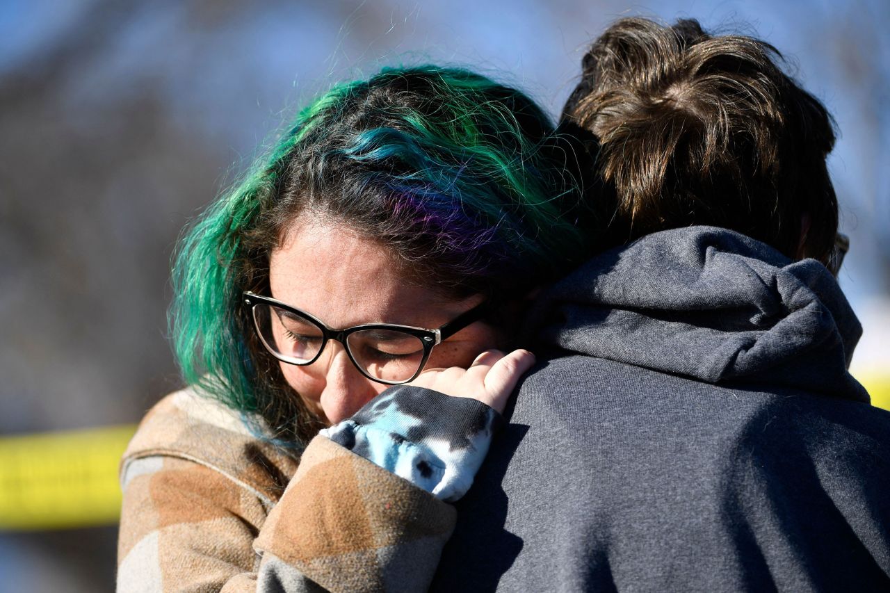 Jessy Smith Cruz embraces Jadzia Dax McClendon the morning after the mass shooting of an LGBTQ nightclub in Colorado Springs on Sunday.