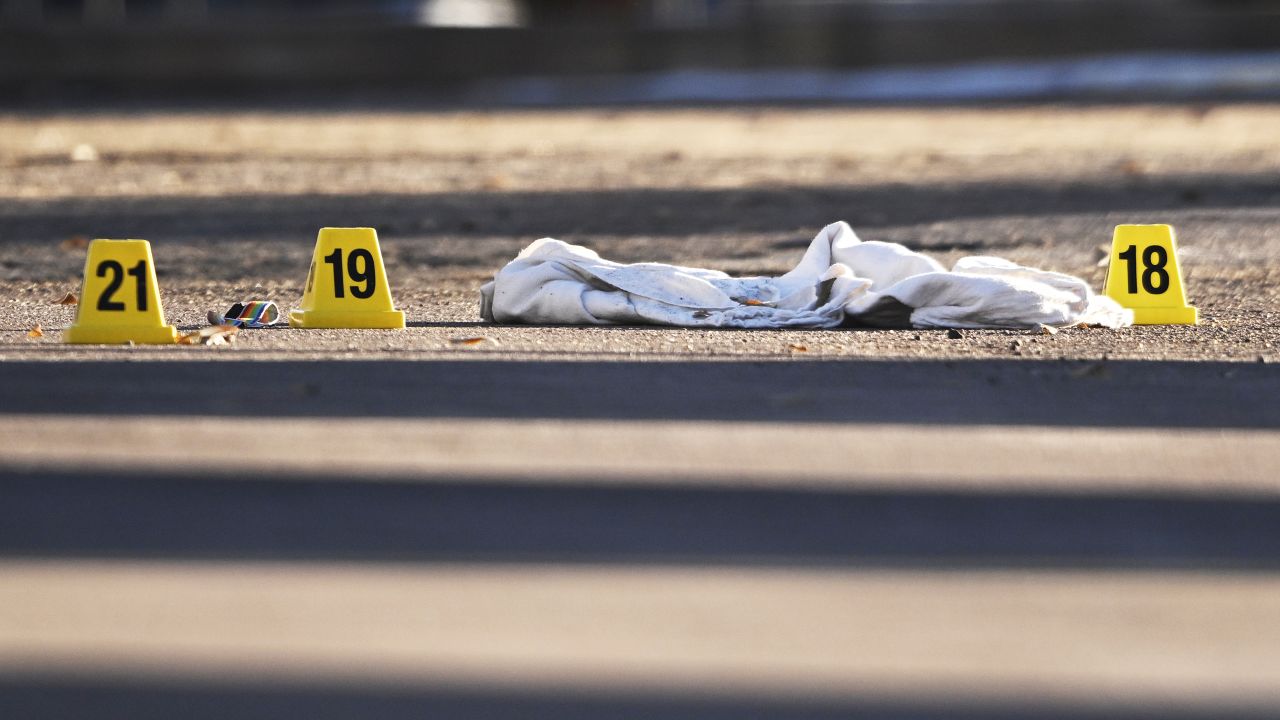 Evidence is marked by authorities outside Club Q in Colorado Springs on the morning after the shooting.