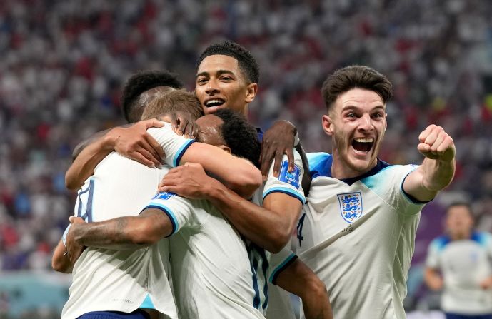 England players celebrate after Raheem Sterling scored a goal during their match against Iran on November 21. England won 6-2.
