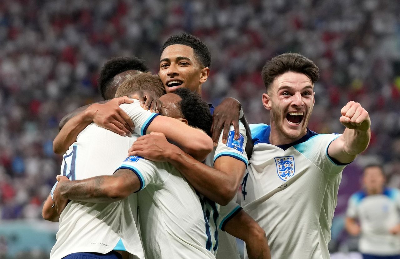 England players celebrate after Raheem Sterling scored a goal during their match against Iran on Monday. England won 6-2.