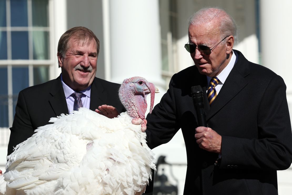 WASHINGTON, DC - NOVEMBER 21: U.S. President Joe Biden pardons Chocolate, the National Thanksgiving Turkey, as he is joined by the 2022 National Turkey Federation Chairman Ronnie Parker on the South Lawn of the White House November 21, 2022 in Washington, DC. Chocolate, and the alternate, Chip, were raised at Circle S. Ranch, outside of Charlotte, North Carolina, and will reside on the campus of North Carolina State University following today's ceremony. (Photo by Win McNamee/Getty Images)