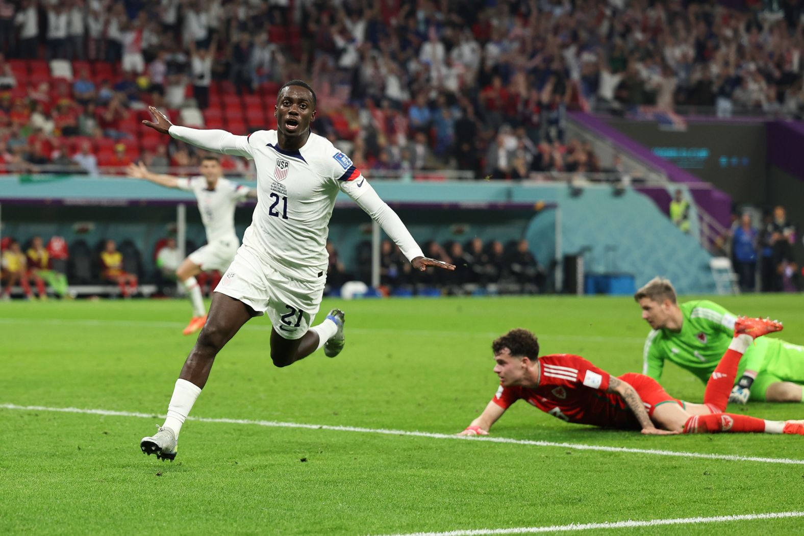 US forward Timothy Weah celebrates after scoring a first-half goal against Wales on November 21. The match ended 1-1.