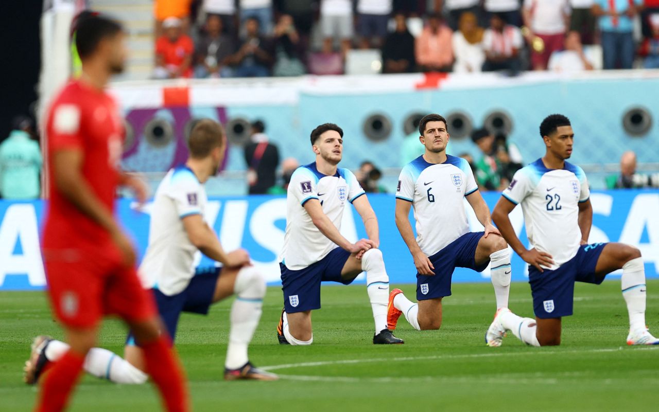 England players take a knee before the start of the Iran match. England manager Gareth Southgate confirmed Sunday that the team would be making the symbolic gesture. "We think it's a strong statement that will go around the world for young people in particular to see that inclusivity is very important," Southgate said.