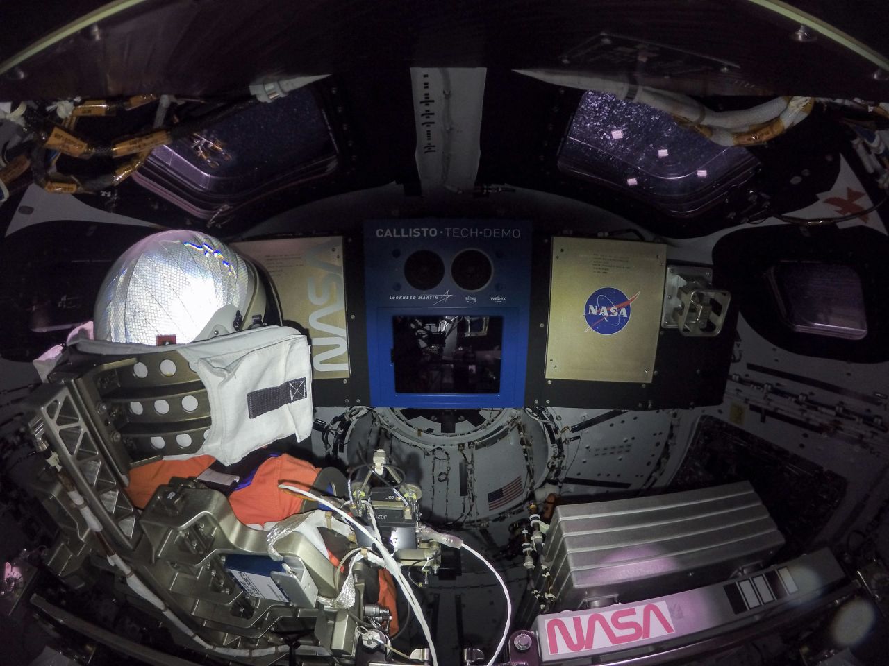 The inside of the Orion crew module is seen on day one in space. At left is Commander Moonikin Campos, a mannequin equipped with sensors to collect data that will help scientists and engineers understand the deep-space environment for future missions.