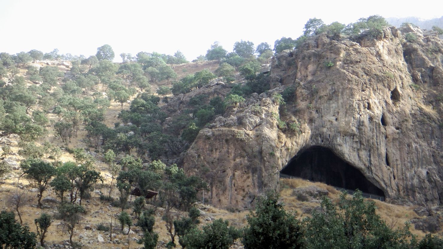 A view of Shanidar Cave in the Zagros Mountains of Iraqi Kurdistan is shown.