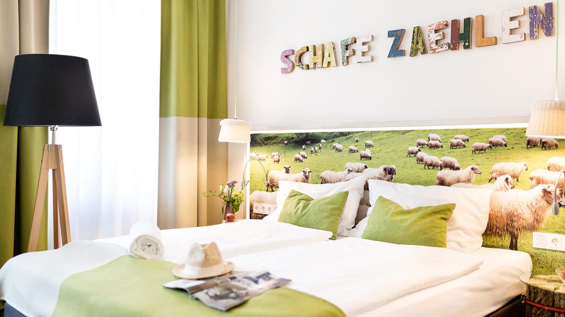 <strong>Boutiquehotel Stadthalle, Austria:</strong> In a restored turn-of-the-century house surrounded by solar panels and garden beds, the 79-room Boutiquehotel Stadthalle has been running on solar power and other renewables since 2009. 